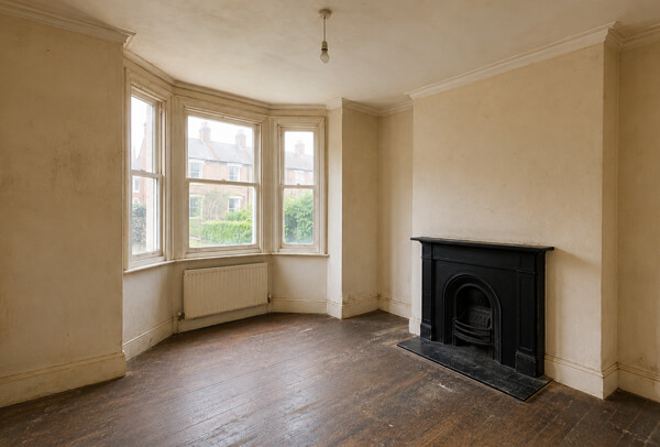 Room in Oxford before painting and decorating with tired walls and older woodwork