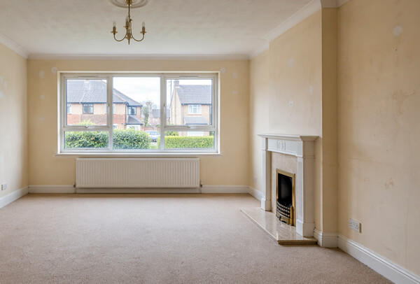 Interior walls in Northampton before painting, with worn and dated decoration