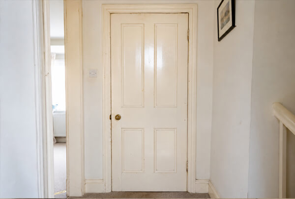 Door before repainting, showing a tired finish ready to be refreshed