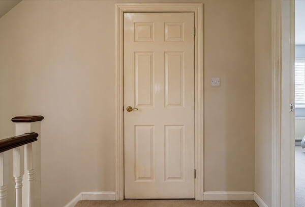 Door before repainting, showing a tired finish ready to be refreshed