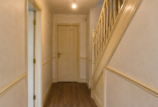 Internal woodwork in Bedford before painting with marked skirting boards and older door frames