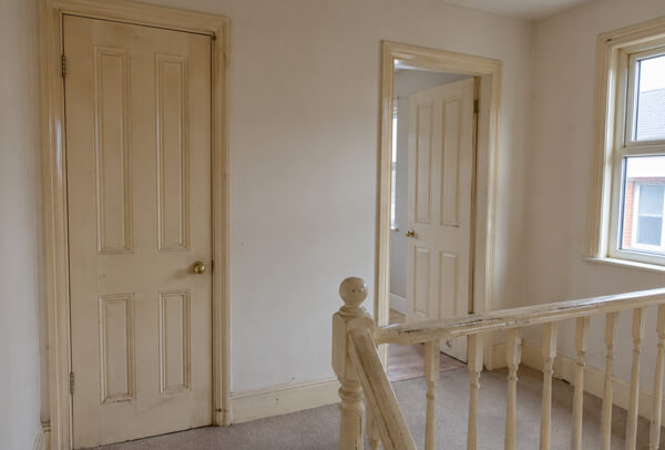Internal woodwork in Luton before painting with marked skirting boards, doors and frames
