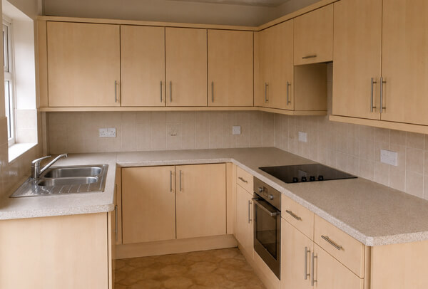 Kitchen cabinets in Bedford before a new colour choice with an older finish that no longer suits the room
