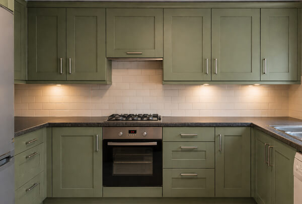 Kitchen cupboards in Northampton after painting, with a lighter cleaner and more modern finish