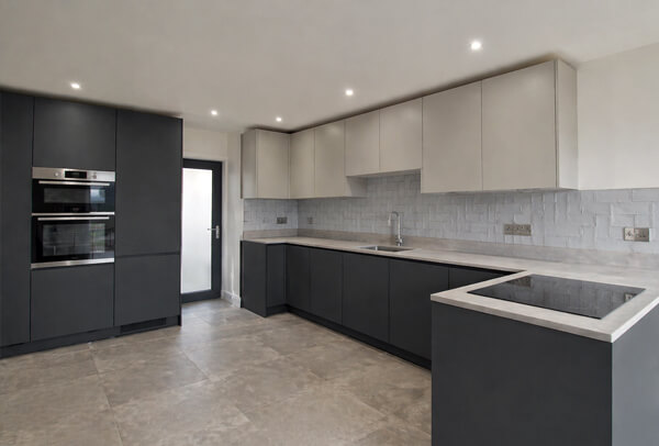 Kitchen cupboards in Northampton after painting, with a cleaner and more modern finish