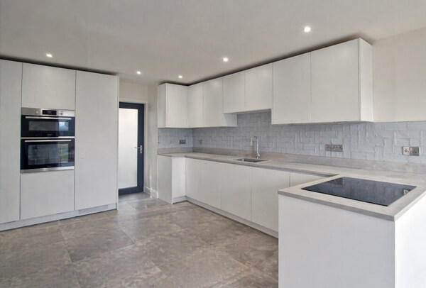 Kitchen cupboards in Northampton before painting, with a dated and tired appearance