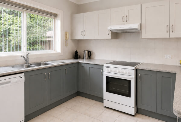 Kitchen after cabinet painting with a fresh updated look