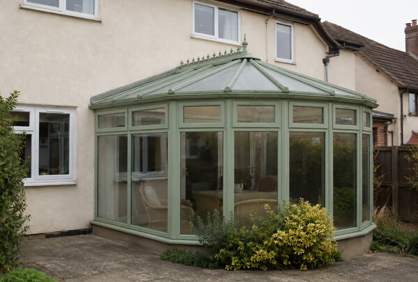 Faded conservatory frames after spraying in Dunstable