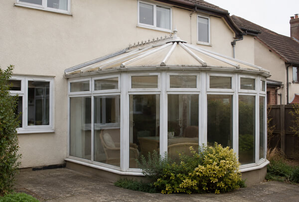 Faded conservatory frames before spraying in Dunstable