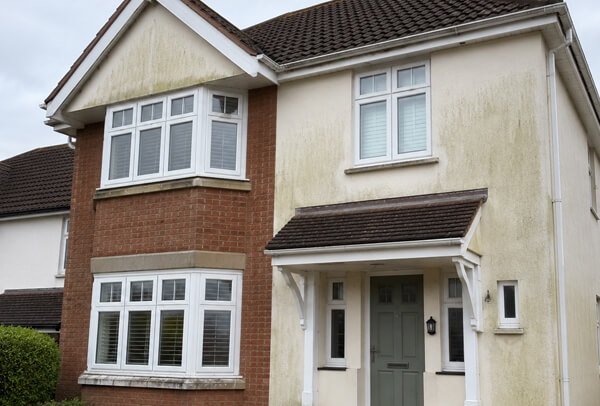 Brick render and painted exterior surfaces in Luton before careful cleaning