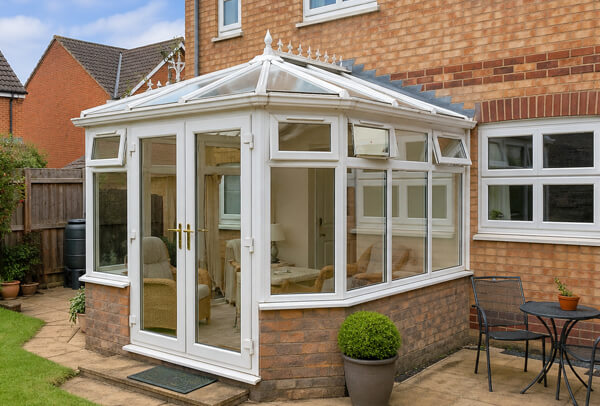 Conservatory in Luton before painting, with tired and dated frames