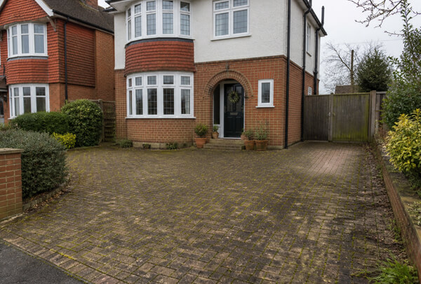 Driveway in Luton before cleaning with moss, algae and weather staining