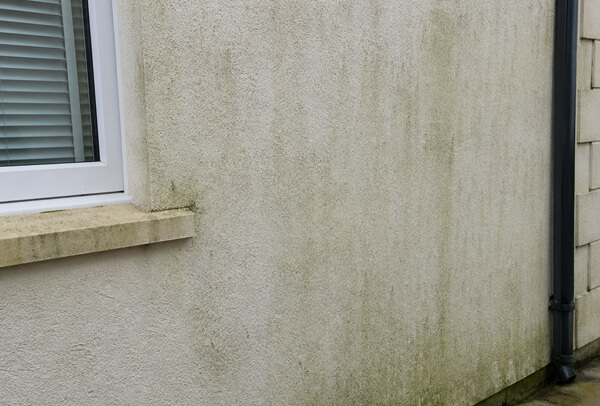 House exterior in Luton before washing, with dirty outside walls and weather staining