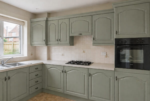 Kitchen cupboards in Luton after painting, with a fresh and modern finish