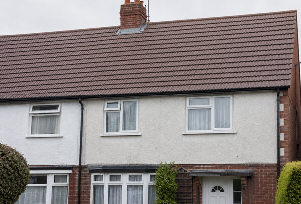 Roof cleaning in Luton after work with moss removed and a cleaner front elevation