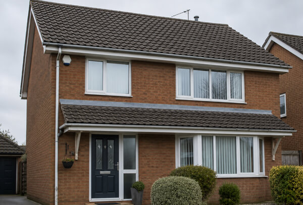 Roof and gutter area in Luton after cleaning with a tidier roofline