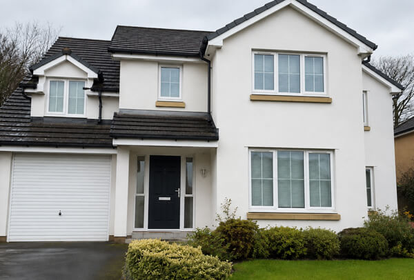 House exterior in Luton after cleaning lower walls, porch and window surrounds