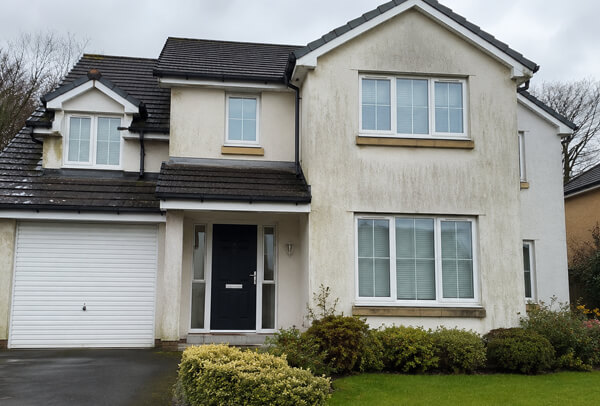 House exterior in Luton before cleaning with dirty lower walls, porch and window surrounds