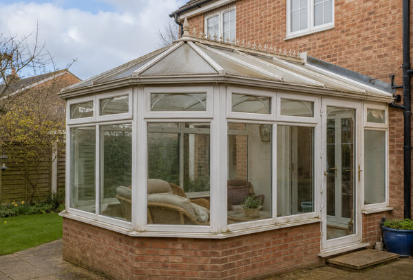 Conservatory in Oxford before painting, with older frames that look tired