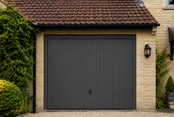 Garage door after repainting in Oxford, showing a cleaner painted finish
