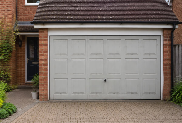 Garage door before repainting, showing a dated colour