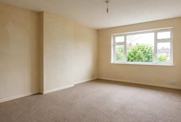 Interior room in Oxford before decorating, with tired walls and an older finish
