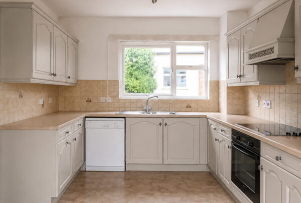 Kitchen cupboards in Oxford after painting, with a professional updated finish