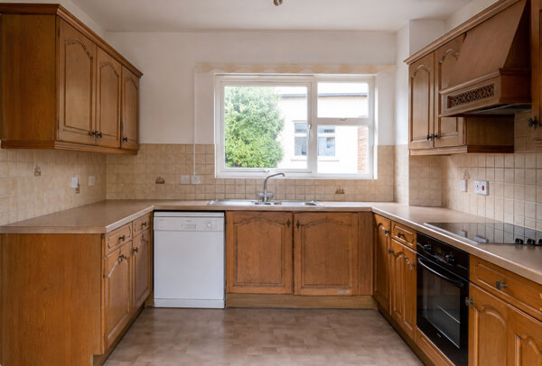 Kitchen cupboards in Oxford before painting, with an older and more dated look