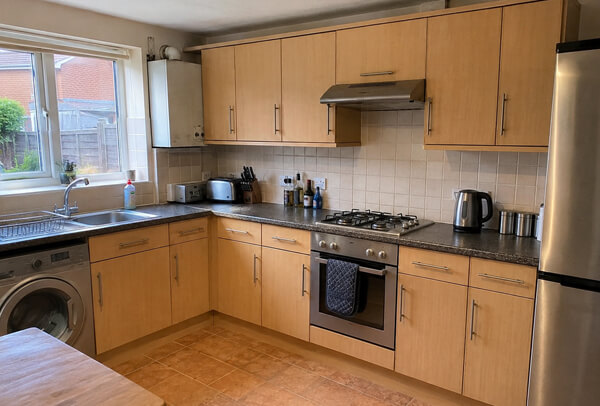 Painted kitchen cabinet project in Bedford before work with cupboard colours that feel dated