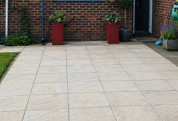 Patio in Northampton after cleaning, with brighter paving and a fresher finish