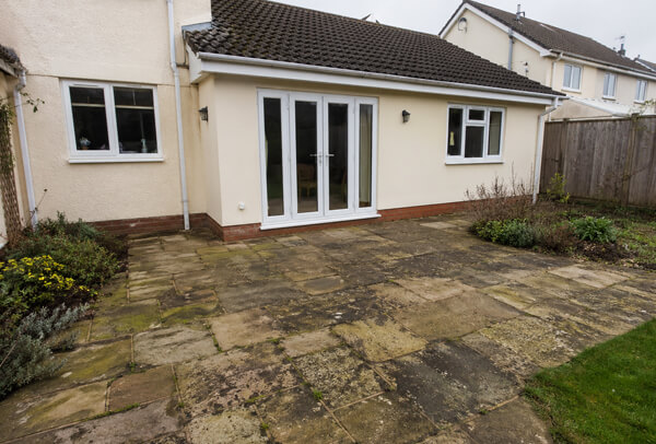 Patio in Luton before deep cleaning with dirt and organic staining