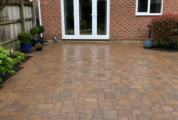 Block paving patio in Bedford after pressure washing and re-sanding