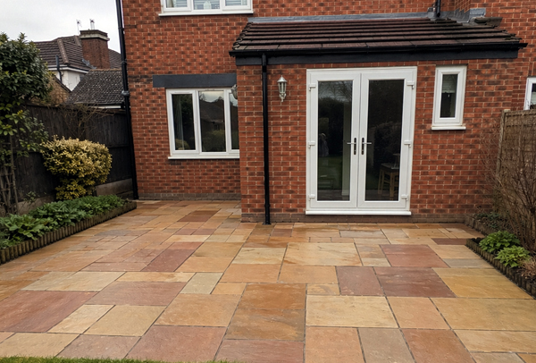 Block paving patio in Northampton after cleaning and re-sanding, with a neater finished look