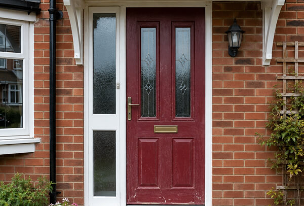 Older front door before repainting, showing a finish that no longer suits the home