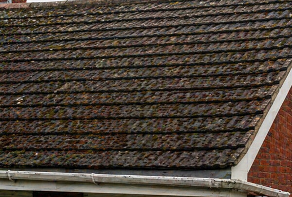 Roof in Northampton before cleaning, with visible moss and weather staining