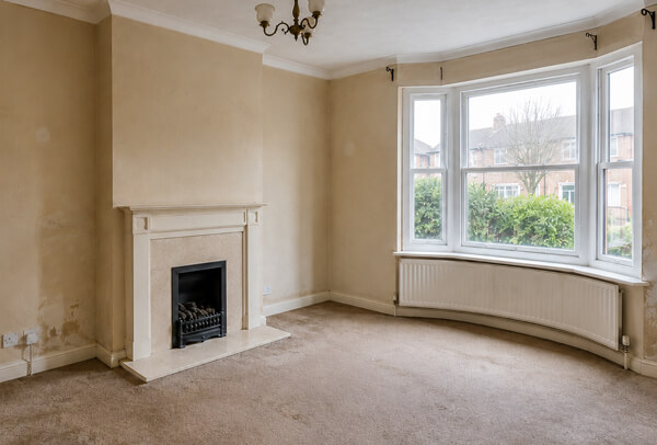 Room in Oxford before interior wall painting with tired walls and an old colour scheme
