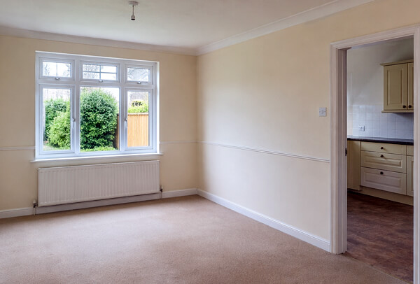 Room in Northampton before redecoration, looking dated and tired