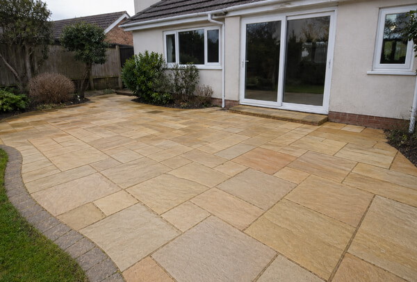 Sandstone patio in Luton after cleaning with a brighter finish