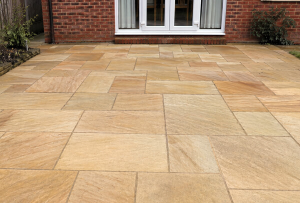 Sandstone patio in Northampton after cleaning, with a lighter cleaner finish