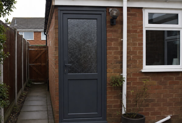 Door after repainting, showing a clean and freshly painted finish