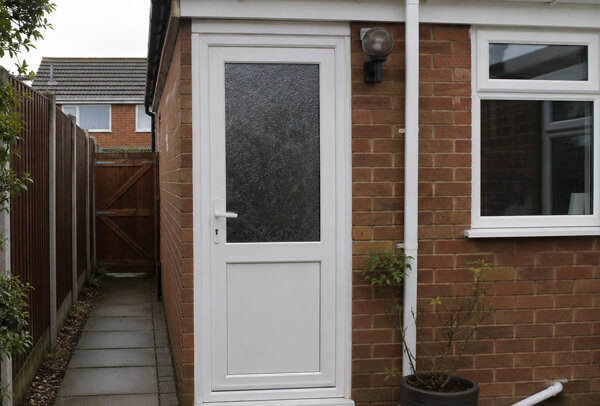 Door before repainting, showing a tired finish ready to be refreshed