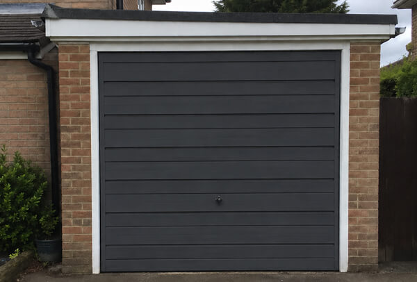 Steel garage door in Luton after repainting, with a cleaner updated finish