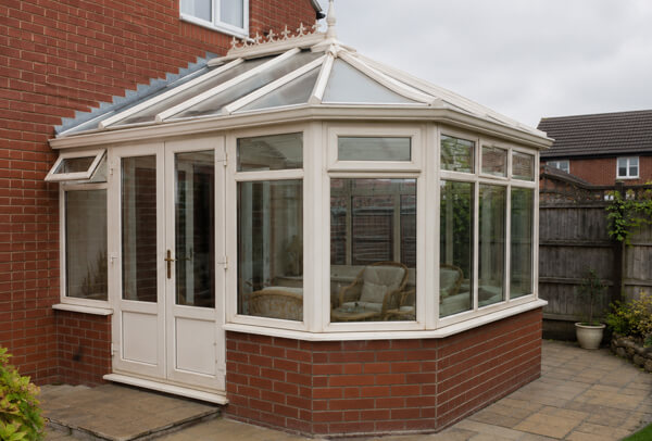 Older uPVC conservatory in Bedford before painting with a dated frame colour