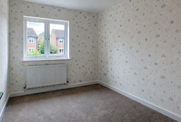 Room in Northampton after wallpapering, with a more decorative finished look