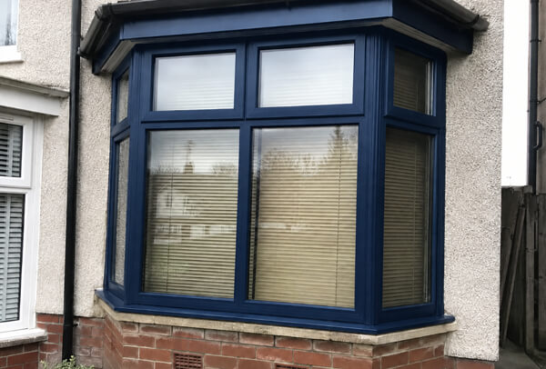 Window frames after neat masking and repainting in Dunstable
