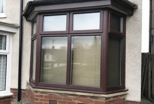 Window frames before masking and repainting in Dunstable