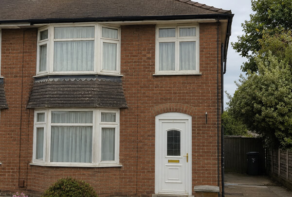 Faded front window frames before repainting in Aylesbury