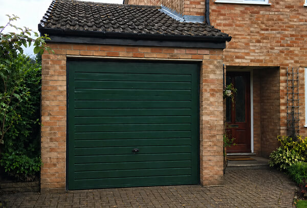 Timber garage door in Luton after repainting, with a fresh smart finish