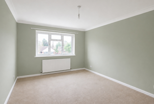Lived in room in Dunstable after painter and decorator work with clean colours and neater woodwork