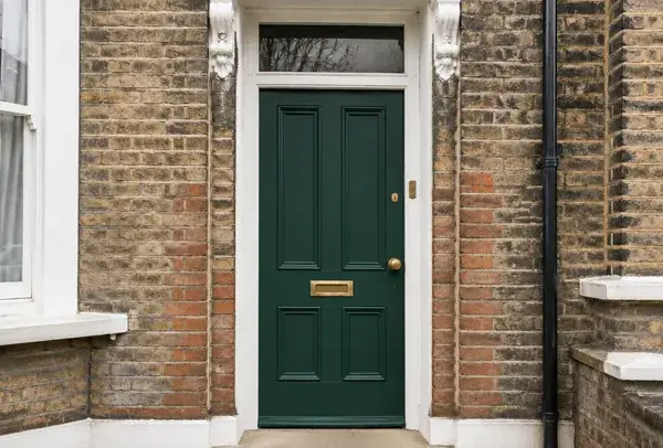 Weathered front door after being refreshed with a new finish